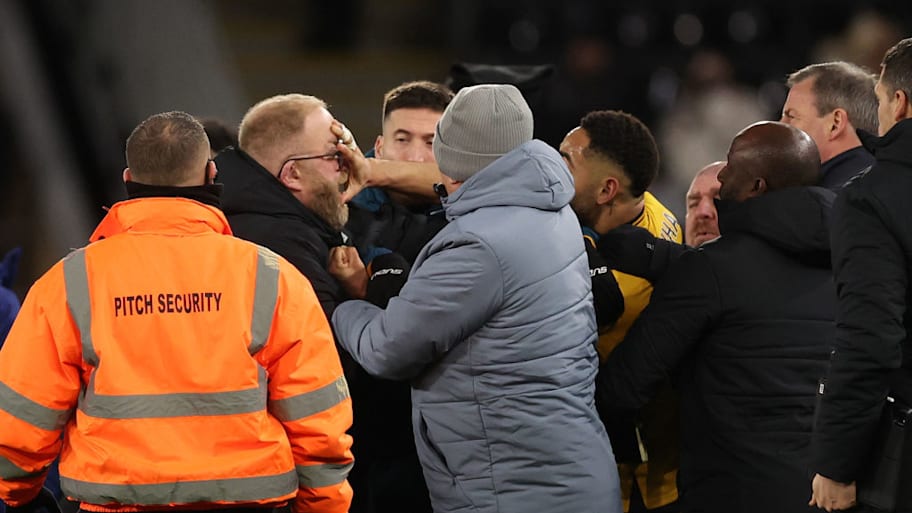 Matheus Cunha clashes with a member of Ipswich Town’s coaching staff.