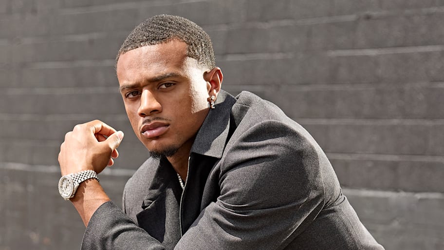 Patrick Surtain crouching