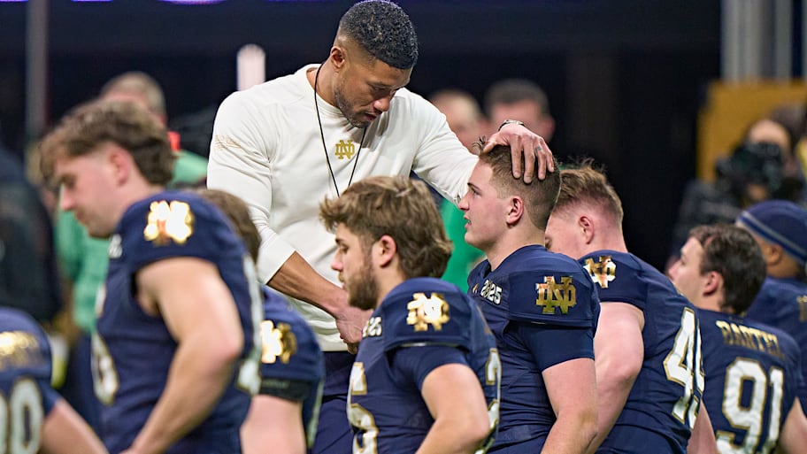 Marcus Freeman greets members of his team.