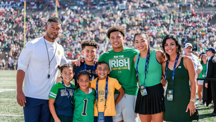 Marcus and his wife of 15 years, Joanna (far right), have their hands full with their four sons and two daughters.