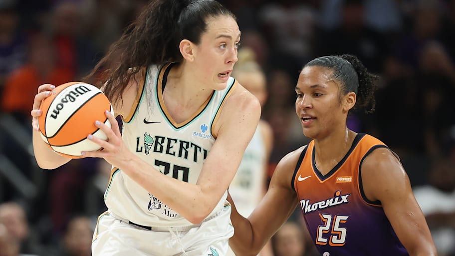 Breanna Stewart #30 of the New York Liberty handles the ball against Alyssa Thomas #25 of the Phoenix Mercury