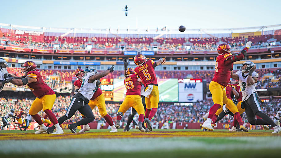 Commanders quarterback Jayden Daniels attempts a pass