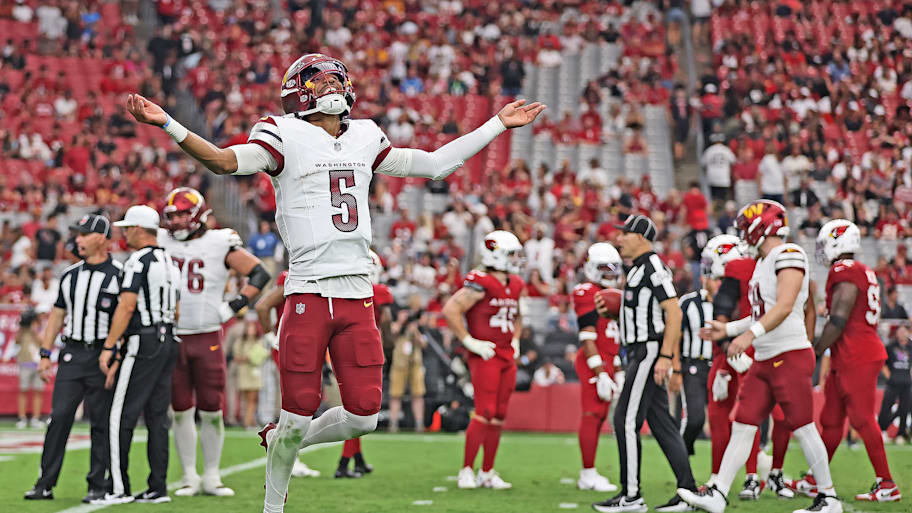  Commanders QB Jayden Daniels reacts after throwing a touchdown against the Cardinals