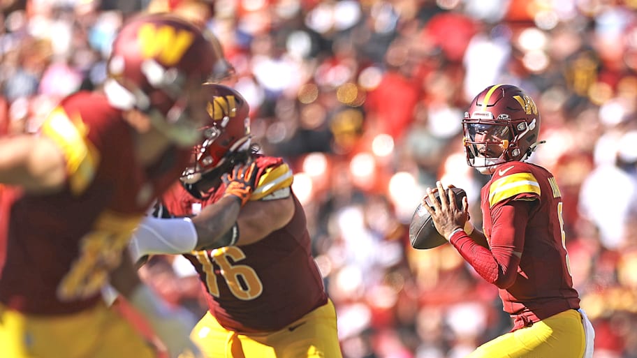 Commanders QB Jayden Daniels looks to pass