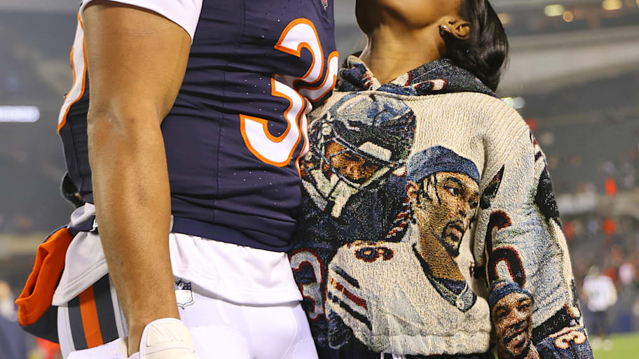Jonathan Owens of the Chicago Bears kisses his wife, gymnast Simone Biles