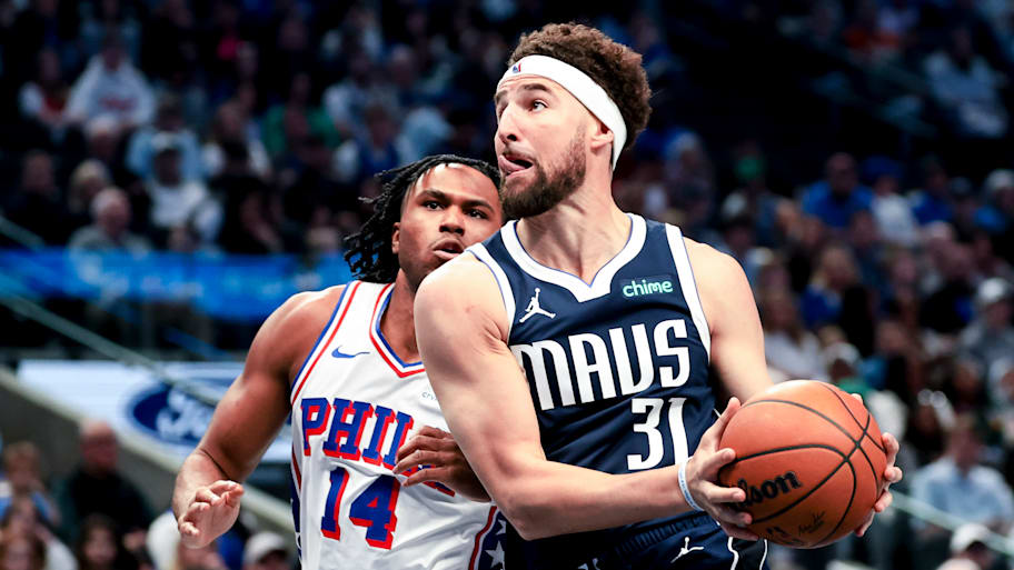 Dallas Mavericks guard Klay Thompson drives to the basket as Philadelphia 76ers guard Ricky Council IV.