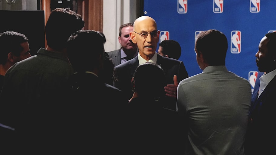 Adam Silver speaks to the media at a press conference.