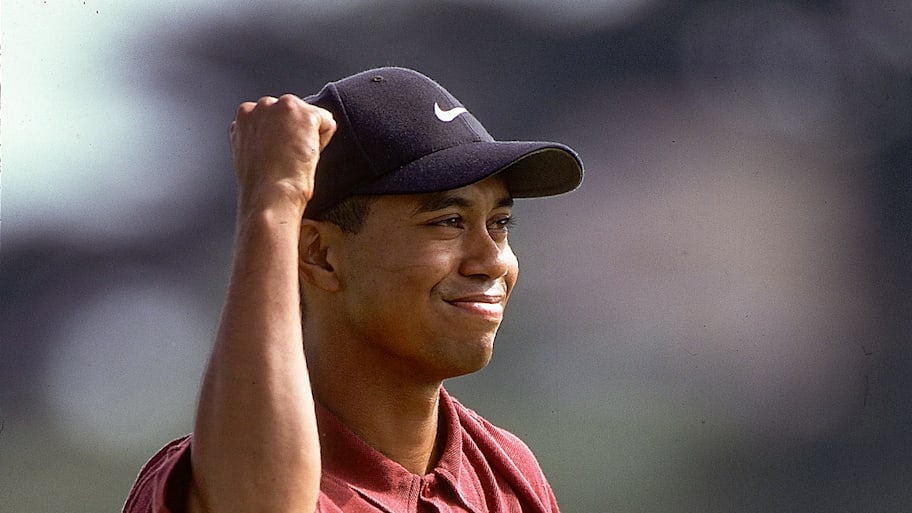 Tiger Woods celebrates with his fist in the air
