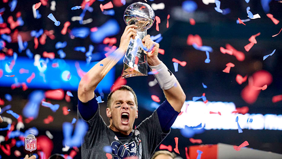 Patriots quarterback Tom Brady holds up the Vince Lombardi Trophy after winning Super Bowl LI against the Falcons
