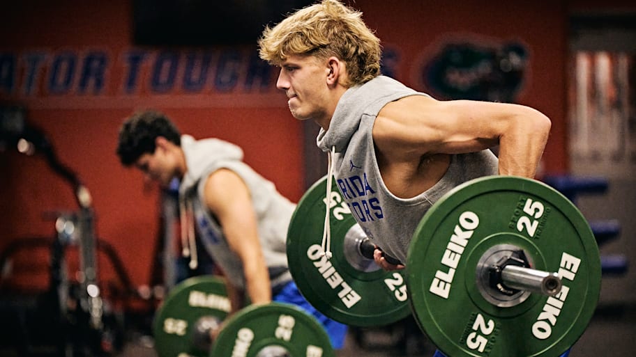 Thomas Haugh lifts weights during a Florida basketball workout.