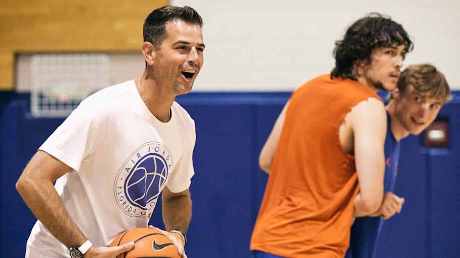 Todd Golden smiles during a Florida basketball practice.