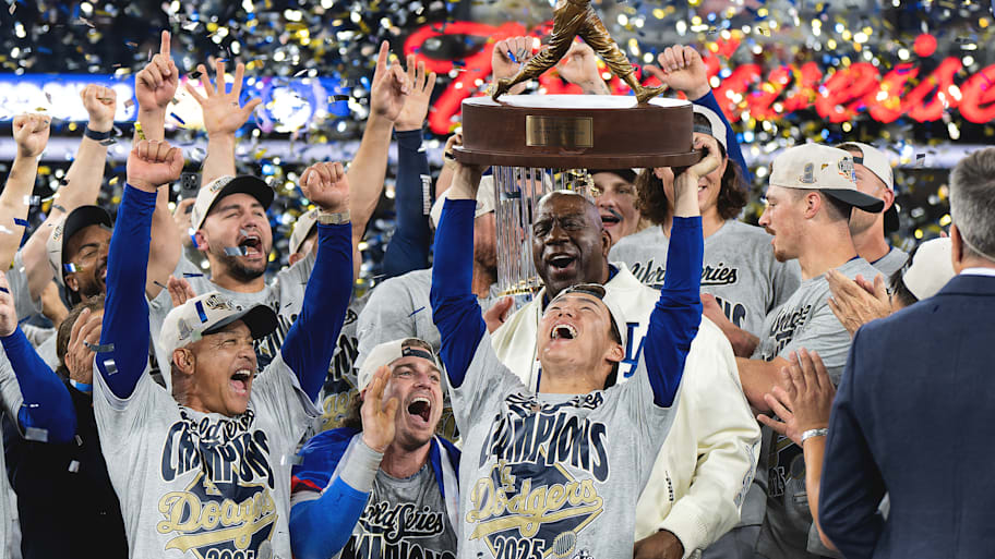 LOs Angeles Dodgers celebrate winning World Series as Yoshinobu Yamamoto holds up World Series MVP trophy