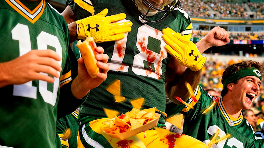 Randal Cobb (18) has one of the more memorable athlete-food interactions in recent history.