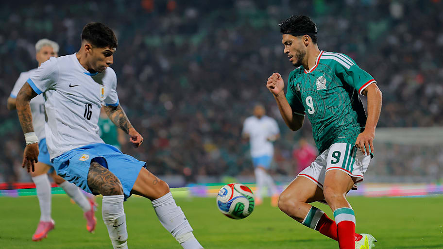 Raúl Jiménez and Mathias Oliveira.