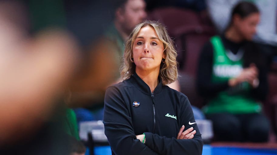 Marshall women's basketball coach Kim Caldwell looks on from the sidelines