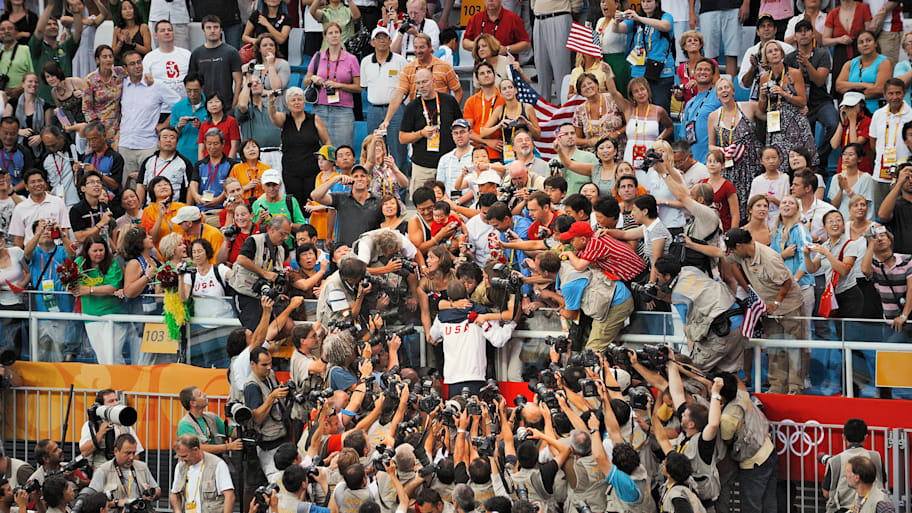 Michael Phelps celebrates with family after winning Men's 4x100M Medley Relay Final gold medal in 2008.