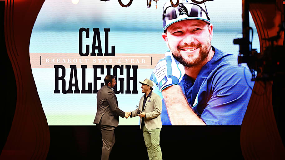 Cal Raleigh accepted the 2025 Breakout Star of the Year award from comedian and friend Adam Ray. 