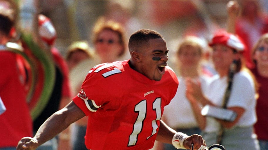 Antwaan Randle El yells with joy as he runs off the field today after Indiana won the game against Iowa