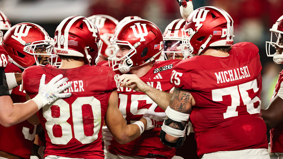 Fernando Mendoza celebrates with his Hoosiers teammates after scoring his fourth-quarter touchdown in the CFP title game.