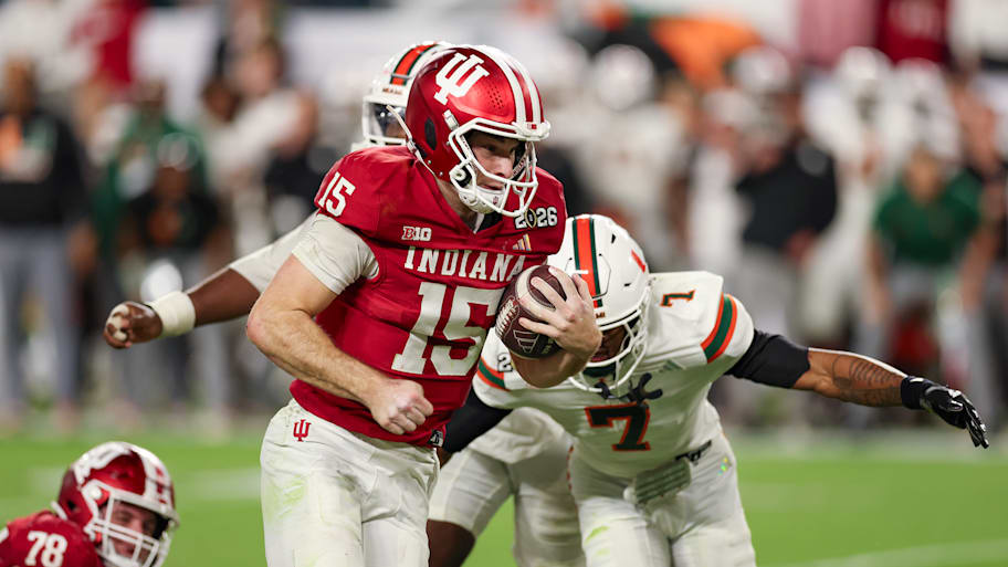 Indiana quarterback Fernando Mendoza runs with the football. 