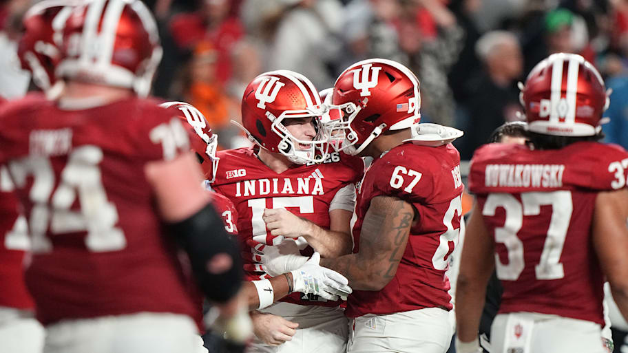Hoosiers quarterback Fernando Mendoza celebrates with his teammates after scoring a touchdown against Miami.