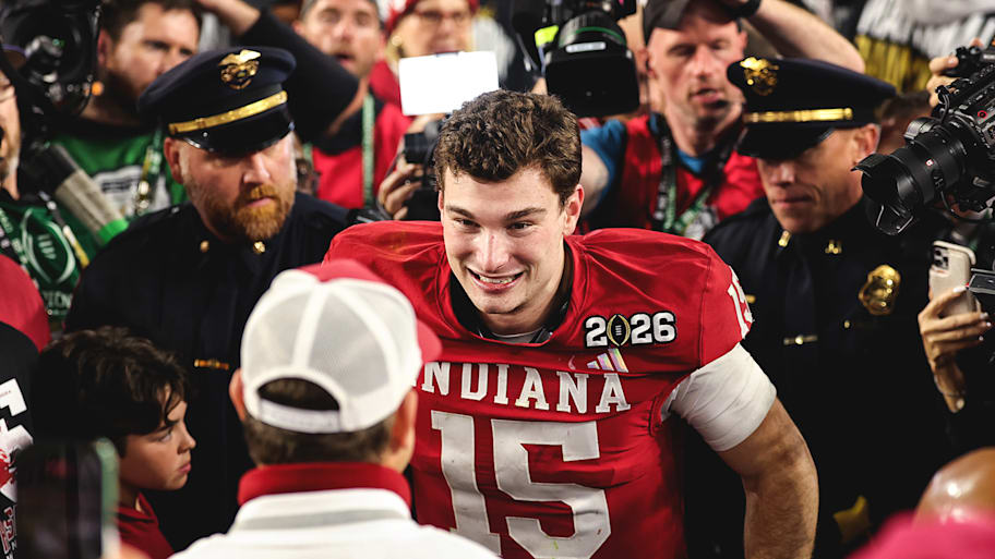 Fernando Mendoza celebrated with his father on the field.