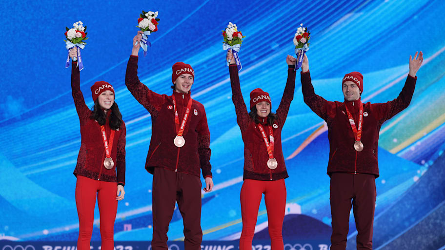 Canada celebrating the mixed team bronze in 2022 as the country’s first ski jumping medal. 