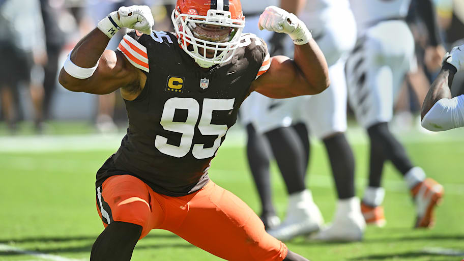 Myles Garrett flexes after a sack