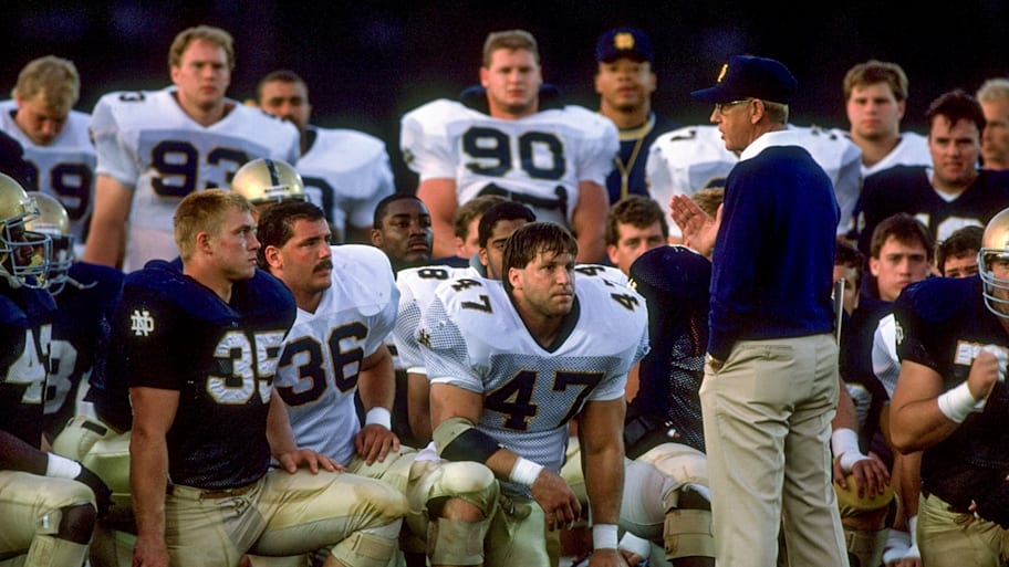 Lou Holtz addresses his 1989 Notre Dame team during practice.