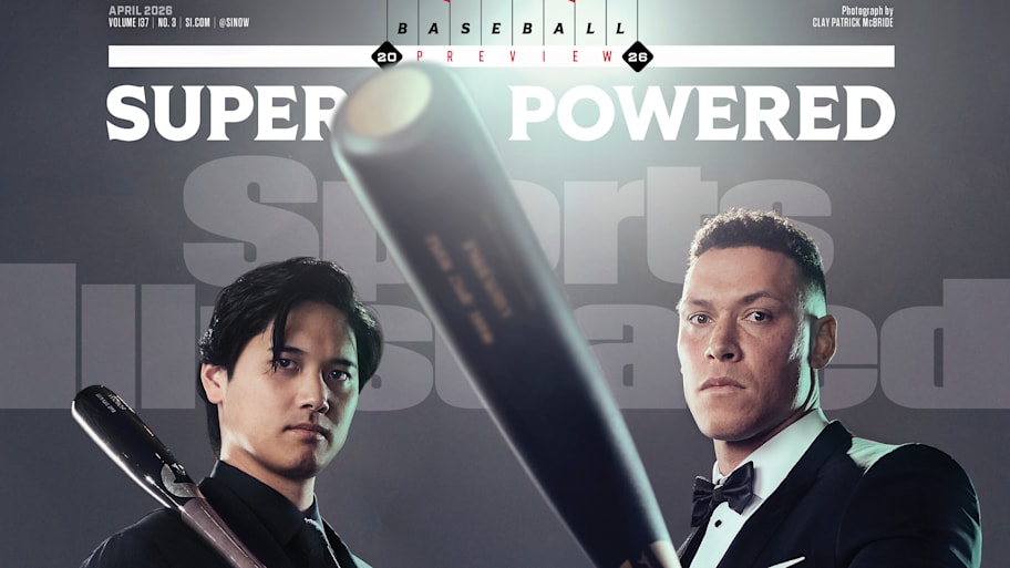 Shohei Ohtani and Aaron Judge pose in suits while holding baseball bats for Sports Illustrated’s April 2026 cover.