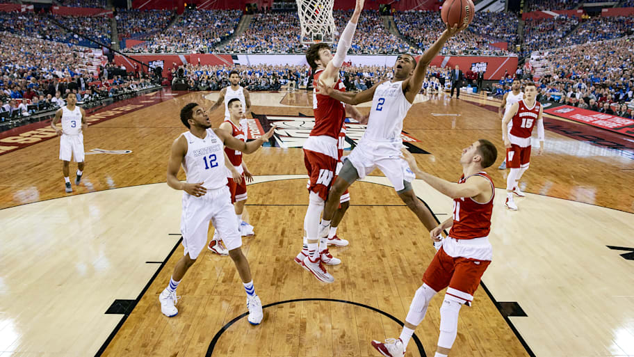 Kentucky’s Aaron Harrison shoots against Wisconsin’s Frank Kaminsky in the 2015 Final Four.