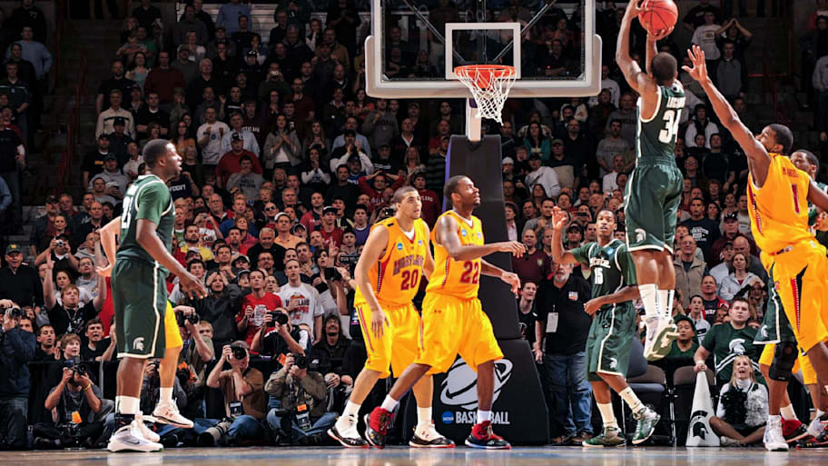 Michigan State’s Korie Lucious shoots game-winning three-pointer at buzzer against Maryland’s Landon Milbourne.