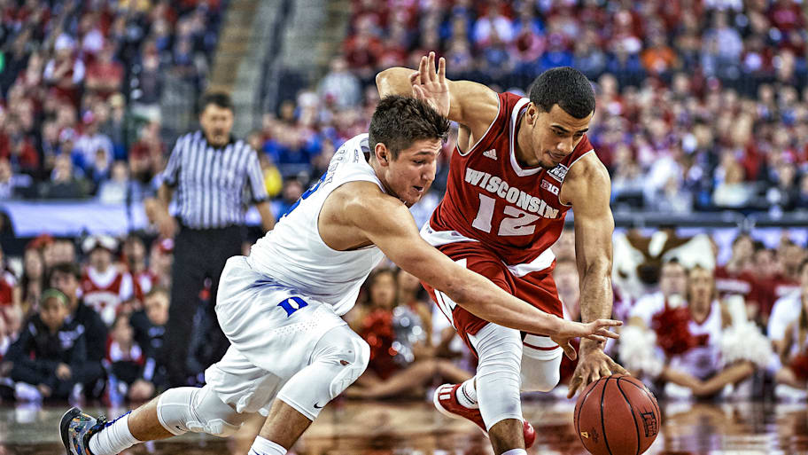 Wisconsin’s Traevon Jackson and Duke’s Grayson Allen dive for a loose ball.