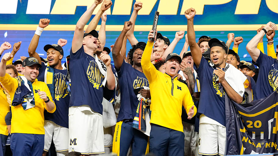 The Wolverines celebrate after winning the 2026 men’s basketball title.