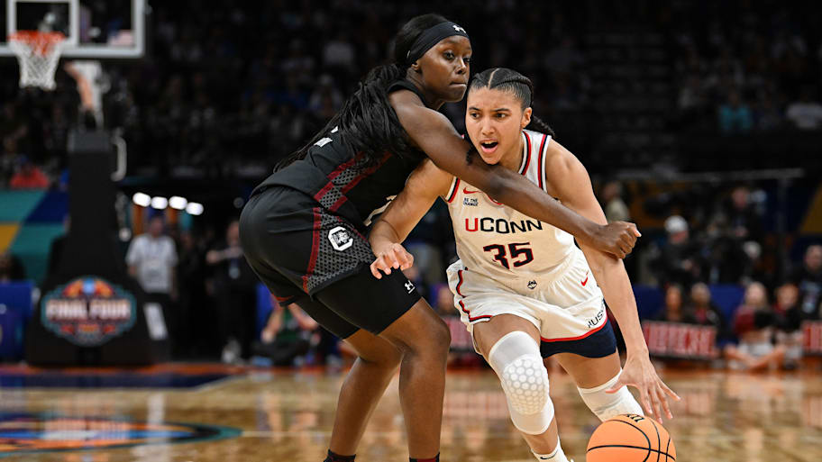 Raven Johnson guards Azzi Fudd