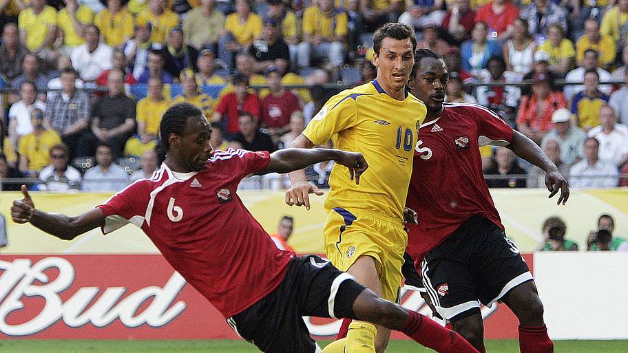 Dennis Lawrence battles Zlatan Ibrahimovic for the ball.