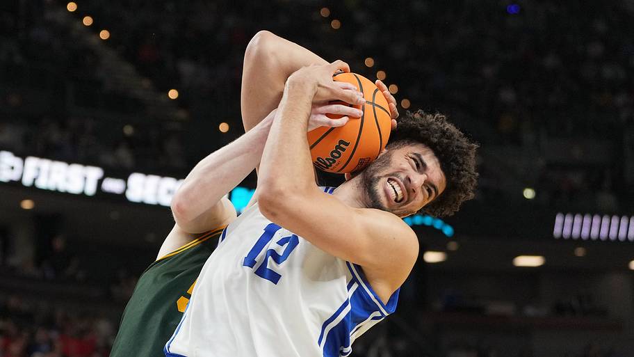 Cameron Boozer wrestling for the ball. 