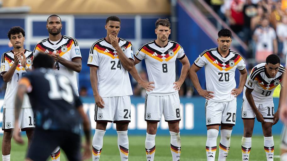 Germany’s players look on dejected during its penalty shootout defeat to Paraguay. 
