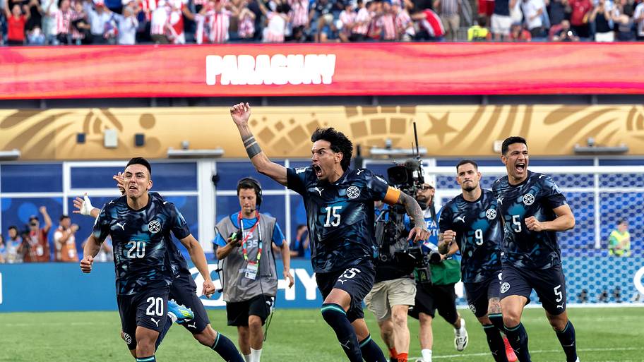 Paraguay celebrate scoring the winning penalty against Germany. 
