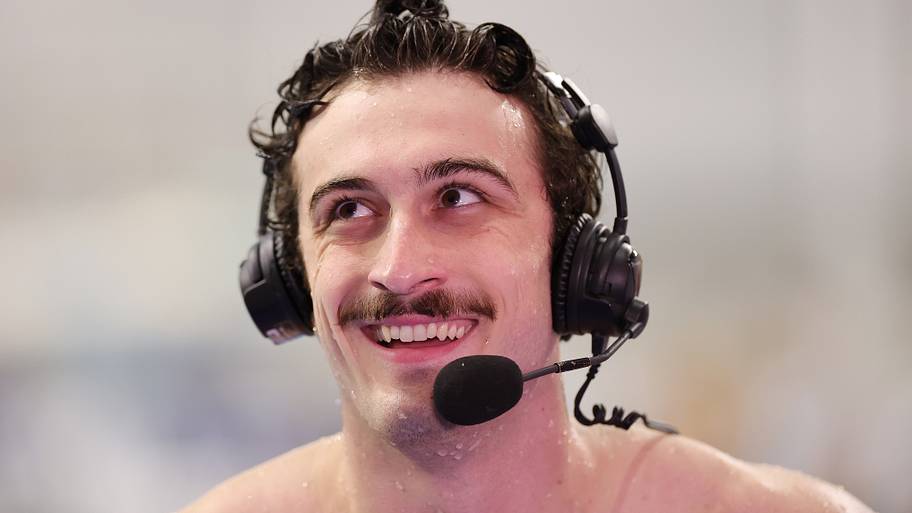 Van Mathias gives an interview after the men’s 50 breaststroke final during the USA Swimming Pro Swim Series Austin.