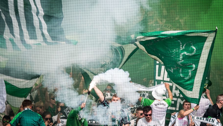 MAINZ, GERMANY - MAY 12: Fans of Bremen ignite smoke bombs prior to the Bundesliga match between 1. FSV Mainz 05 and SV Werder Bremen at Opel Arena on May 12, 2018 in Mainz, Germany. (Photo by Lukas Schulze/Bongarts/Getty Images)