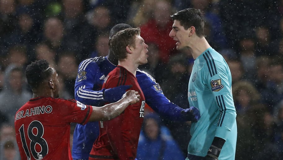 Chelsea's Belgian goalkeeper Thibaut Courtois (R) clashes with West Bromwich Albion's Irish midfielder James McClean during the English Premier League football match between Chelsea and West Bromwich Albion at Stamford Bridge in London on January 13, 2016. AFP PHOTO / IAN KINGTON

RESTRICTED TO EDITORIAL USE. NO USE WITH UNAUTHORIZED AUDIO, VIDEO, DATA, FIXTURE LISTS, CLUB/LEAGUE LOGOS OR 'LIVE' SERVICES. ONLINE IN-MATCH USE LIMITED TO 75 IMAGES, NO VIDEO EMULATION. NO USE IN BETTING, GAMES OR SINGLE CLUB/LEAGUE/PLAYER PUBLICATIONS. / AFP / IAN KINGTON        (Photo credit should read IAN KINGTON/AFP/Getty Images)