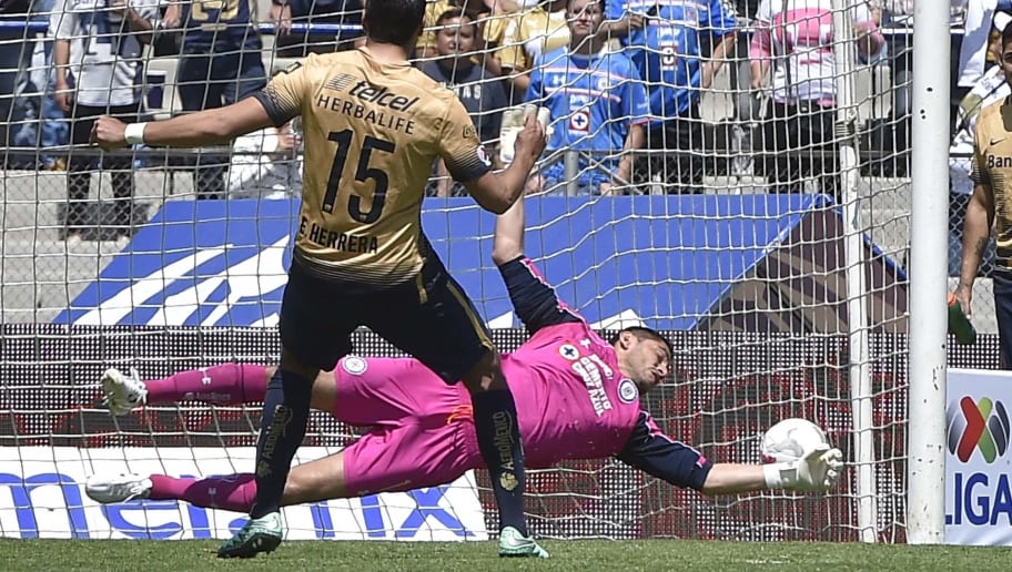 OMAR TORRES/GettyImages Eduardo Herrera (R) of Pumas scores the second goal by penalty kick past Cruz Azul's goalkeeper Jesus Corona during a Mexican Clausura football tournament match at the Olympic Stadium in Mexico City, on March 6, 2016. AFP PHOTO / OMAR TORRES / AFP / OMAR TORRES (Photo credit should read OMAR TORRES/AFP/Getty Images)