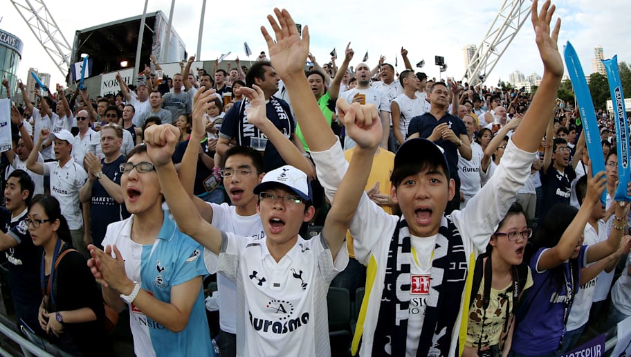 Chris McGrath/GettyImages SO KON PO, HONG KONG - JULY 27: Fans cheer for their team during the Third Place Play-Off match between Tottenham and South China at Hong Kong Stadium on July 27, 2013 in So Kon Po, Hong Kong. (Photo by Chris McGrath/Getty Images for FA Premier League)