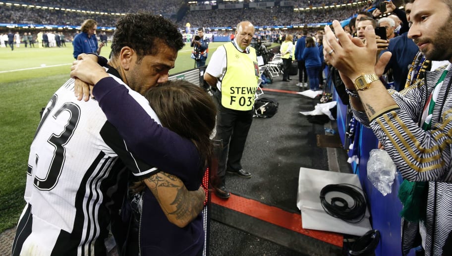 Juventus' Brazilian defender Dani Alves reacts after Real Madrid won the UEFA Champions League final football match between Juventus and Real Madrid at The Principality Stadium in Cardiff, south Wales, on June 3, 2017. / AFP PHOTO / ADRIAN DENNIS        (Photo credit should read ADRIAN DENNIS/AFP/Getty Images)