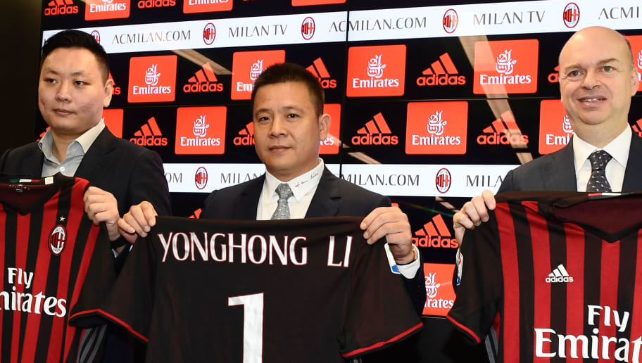 Head of Rossoneri Sport Investment Lux, Chinese businessman and new owner of the AC Milan football club, Yonghong Li (C) poses with Italian businessman Marco Fassone (R) and Rossoneri Sport Investment Lux representative David Han Li (L) during a press conference on April 14, 2017 in Milan.

Serie A giants AC Milan were sold to Rossoneri Sport Investment Lux yesterday in a deal which sees the Chinese-led consortium take a 99.9% stake in the club. The seven-time European champions who are Italy's most succcessful club in international competition, have been owned by former three-time Italy prime minister Silvio Berlusconi since 1986. A joint statement by AC Milan's holding company Fininvest and Rossoneri Sport Investment Lux said on April 13, 2017 : 'Today Fininvest has completed the sale of the entire stake owned in AC Milan - equal to 99.93% - to Rossoneri Sport Investment Lux.'
 / AFP PHOTO / MIGUEL MEDINA        (Photo credit should read MIGUEL MEDINA/AFP/Getty Images)