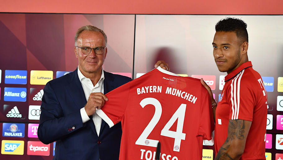 Sebastian Widmann/GettyImages MUNICH, GERMANY - JULY 10: Karl-Heinz Rummenigge, CEO of FC Bayern Muenchen presents with Corentin Tolisso his new jersey number at Saebener Strasse training ground on July 10, 2017 in Munich, Germany. (Photo by Sebastian Widmann/Bongarts/Getty Images)