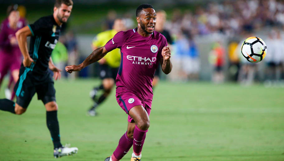 Manchester City midfielder Raheem Sterling, right, drives the ball against Real Madrid during the second half of the International Champions Cup match on July 26, 2017 in Los Angeles, California. Manchester City won 4-1. / AFP PHOTO / RINGO CHIU (Photo credit should read RINGO CHIU/AFP/Getty Images)