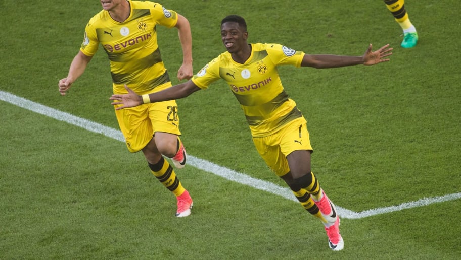Dortmund's French midfielder Ousmane Dembele (R) celebrates scoring the opening goal with Polish defender Lukasz Piszczek during the German Cup (DFB Pokal) final football match Eintracht Frankfurt v BVB Borussia Dortmund at the Olympic stadium in Berlin on May 27, 2017. / AFP PHOTO / Odd ANDERSEN / RESTRICTIONS: ACCORDING TO DFB RULES IMAGE SEQUENCES TO SIMULATE VIDEO IS NOT ALLOWED DURING MATCH TIME. MOBILE (MMS) USE IS NOT ALLOWED DURING AND FOR FURTHER TWO HOURS AFTER THE MATCH. == RESTRICTED TO EDITORIAL USE == FOR MORE INFORMATION CONTACT DFB DIRECTLY AT +49 69 67880

 /         (Photo credit should read ODD ANDERSEN/AFP/Getty Images)