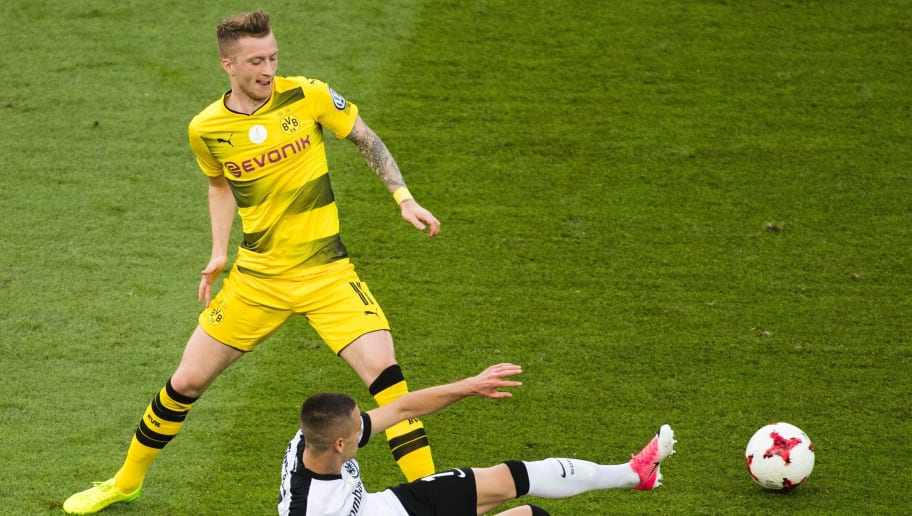Dortmund's forward Marco Reus (L) and Frankfurt's Serbian midfielder Mijat Gacinovic vie for the ball during the German Cup (DFB Pokal) final football match Eintracht Frankfurt v BVB Borussia Dortmund at the Olympic stadium in Berlin on May 27, 2017.
Marco Reus' injury misery continues on May 29, 2017 when Borussia Dortmund confirmed the winger partially tore his cruciate ligament in Saturday's German Cup final - a set-back which could sideline him for months. / AFP PHOTO / Odd ANDERSEN / RESTRICTIONS: ACCORDING TO DFB RULES IMAGE SEQUENCES TO SIMULATE VIDEO IS NOT ALLOWED DURING MATCH TIME. MOBILE (MMS) USE IS NOT ALLOWED DURING AND FOR FURTHER TWO HOURS AFTER THE MATCH. == RESTRICTED TO EDITORIAL USE == FOR MORE INFORMATION CONTACT DFB DIRECTLY AT +49 69 67880

 /         (Photo credit should read ODD ANDERSEN/AFP/Getty Images)